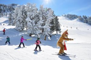 a group of people skiing on a snow covered slope at Gasthof Burkert in Oetz