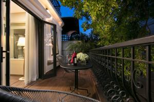 A balcony or terrace at Hanoi L'Heritage Diamond Hotel & Spa