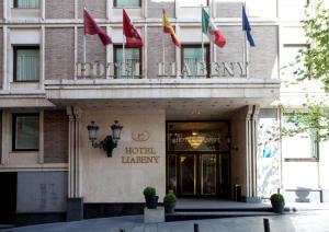 a hotel lobby with flags in front of a building at Hotel Liabeny in Madrid