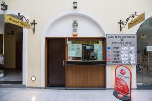 a store front with a revolving door in a building at Hotel Leul de Aur in Sebeş