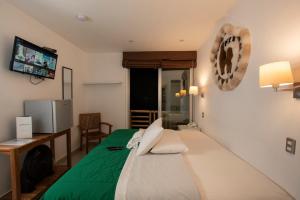 เตียงในห้องที่ Hotel Riviera Inka Paracas