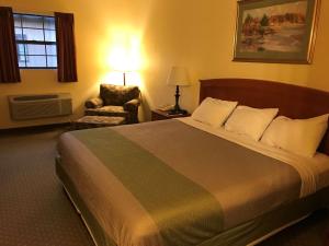 A bed or beds in a room at Motel 6-Bloomsburg, PA