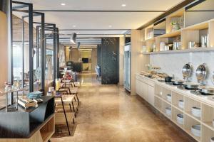 A restaurant or other place to eat at Novotel Jakarta Mangga Dua Square