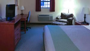 A bed or beds in a room at Motel 6-Bloomsburg, PA