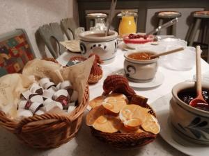 a table with baskets of food on a table at Garni-Pension Andrä in Schierke