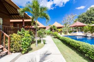 Villa con piscina y complejo en Dream Beach Cottages, en Nusa Lembongan