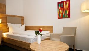 Cama ou camas em um quarto em Hotel Schaper