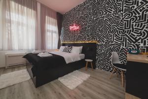 Gulta vai gultas numurā naktsmītnē Hotel Marienplatz Podgorica