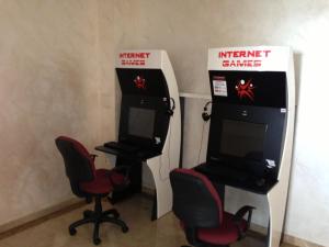 a video game room with two chairs and a machine at Hotel & SPA Diamant Residence - All Inclusive in Sunny Beach