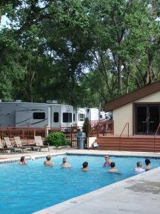 a group of people in a swimming pool at Garden of the Gods RV Resort in Colorado Springs