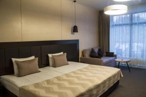 Кровать или кровати в номере Sobi Hotel