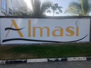 a sign that says ximas on a banner at Almasi Oceanfront Nyali in Mombasa