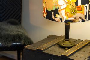 a lamp sitting on top of a wooden table at Zandvoort Studio in Zandvoort