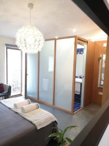 Giường trong phòng chung tại Apartamentos 14DeSande