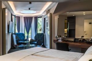 Tempat tidur dalam kamar di Best Western Premier Natalija Residence