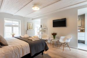 Posteľ alebo postele v izbe v ubytovaní B&B Gracht 62