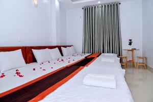 A bed or beds in a room at Sevensea Vung Tau