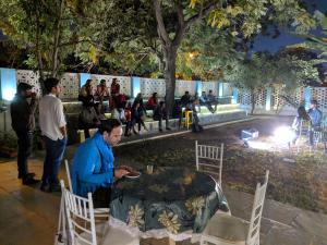 a man sitting at a table with a plate of food at Jaipur Jantar Hostel in Jaipur