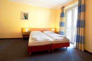 Posteľ alebo postele v izbe v ubytovaní Euro Youth Hotel & Krone