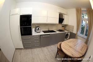 Cucina o angolo cottura di Apartments Morski Svet Portorož