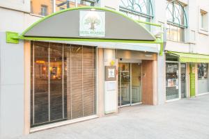 a store front of a store with a sign on it at Hôtel Provence in Draguignan