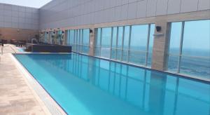 The swimming pool at or close to Royal M Hotel Fujairah by Gewan