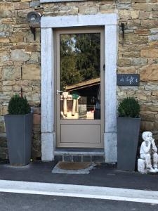 a front door of a building with a window at Gîte de Corbion Loft1 in Ciney