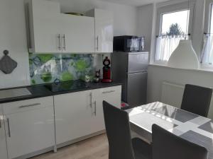 O bucătărie sau chicinetă la Ferienwohnung Jasmin