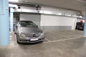 a silver car parked in a garage at Apartaments Centre Figueres in Figueres