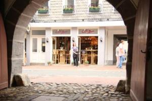 a person standing in front of a store at Hotel Garni Kaiserpfalz in Goslar