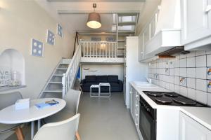 A kitchen or kitchenette at ALMYRA SeaView Maisonette in Naousa