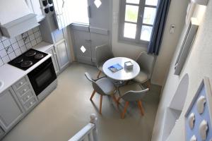 A kitchen or kitchenette at ALMYRA SeaView Maisonette in Naousa