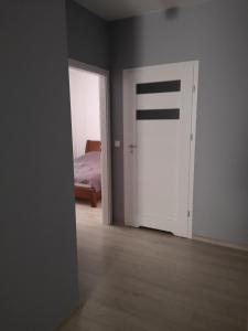 Llit o llits en una habitació de Apartament Południowy