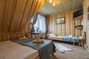 A bed or beds in a room at Agrotatry U Stachy