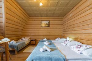 A bed or beds in a room at Agrotatry U Stachy