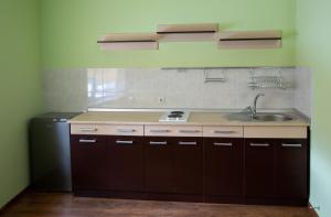 a kitchen with a sink and a counter top at Hotel Complex Olimp in Umanʼ