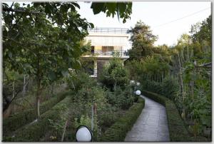 A garden outside Anni's apartments 50m from the beach