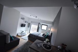 Una cama o camas en una habitación de Urban Apartment