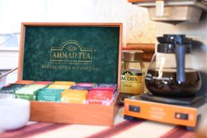 a box of spices and a coffee maker on a table at Villa Žerotín Penzion Bed & Breakfast in Velké Losiny