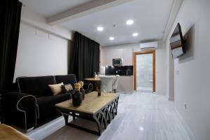 BiBo Suites Gran Vía में टेलीविजन और/या मनोरंजन केंद्र