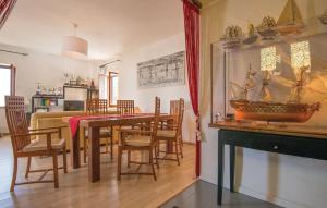 a dining room with a table with a boat on the wall at GAETA - Villa Fontania in Gaeta