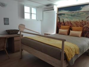 Una cama o camas en una habitación de Guesthouse Alentejo