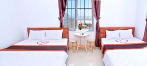 A bed or beds in a room at Sevensea Vung Tau