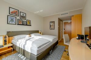 Giường trong phòng chung tại Mercure Hotel Bochum City