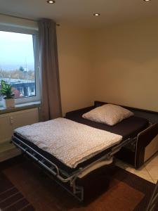 Posteľ alebo postele v izbe v ubytovaní S&B Apartment