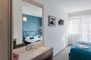 Vuode tai vuoteita majoituspaikassa Hotel Porec