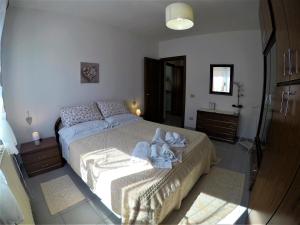 Кровать или кровати в номере Sardinia-holiday casa Pesce Palla