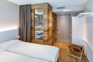 Krevet ili kreveti u jedinici u okviru objekta Hotel Allegra Lodge