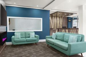 A seating area at Days Inn by Wyndham Saint John