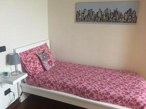 Кровать или кровати в номере Feeling at Home - Varese Apartment